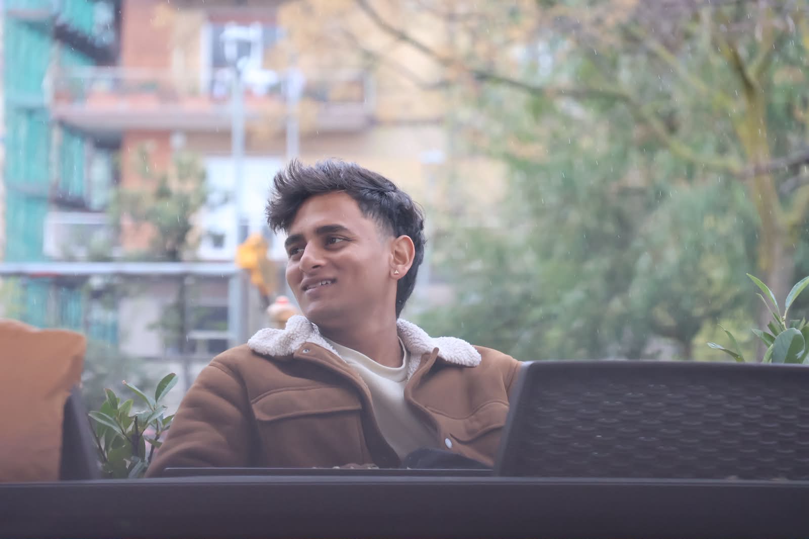 Candid smile at a café with laptop