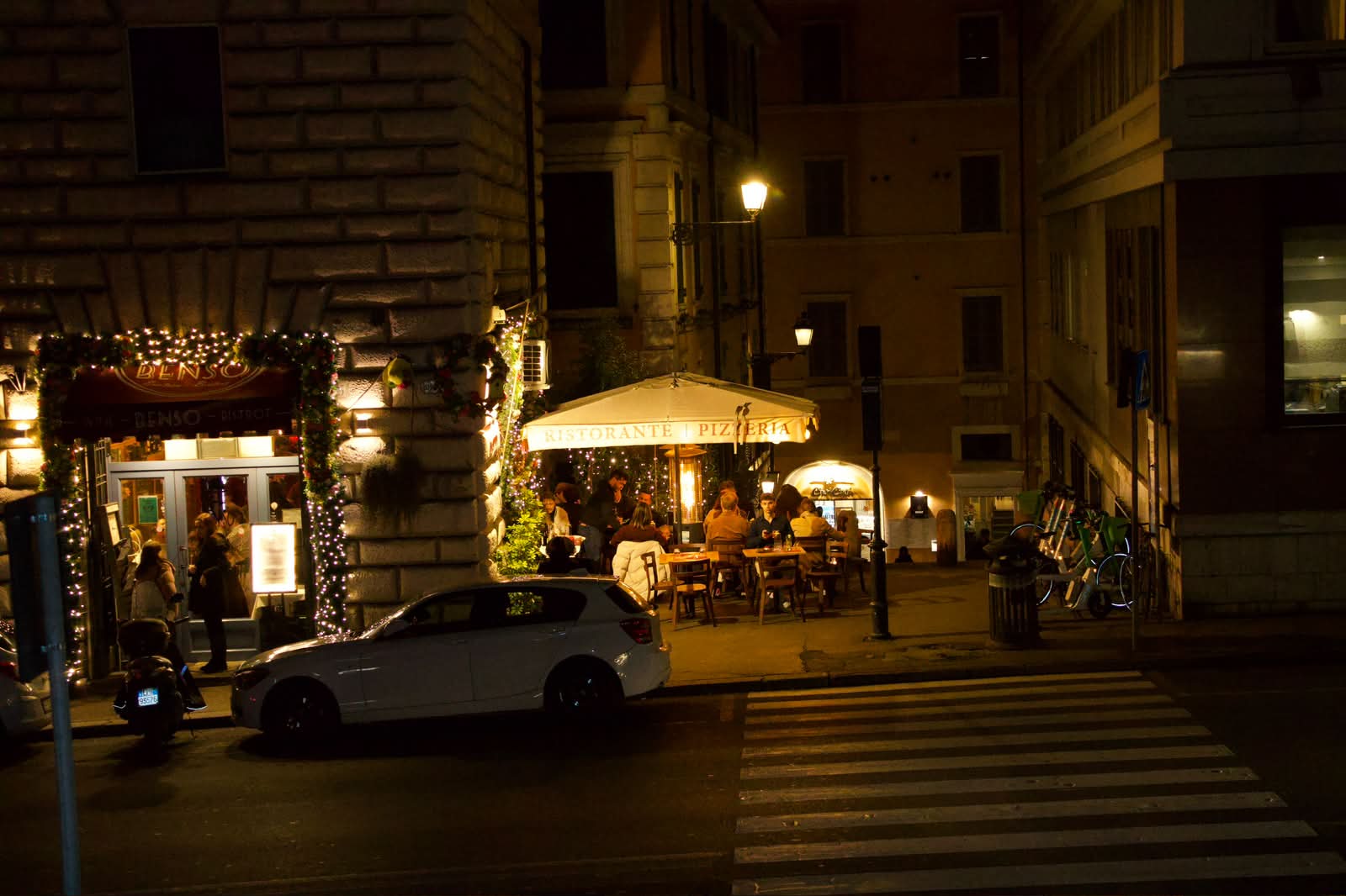 Roman ristorante glowing at night