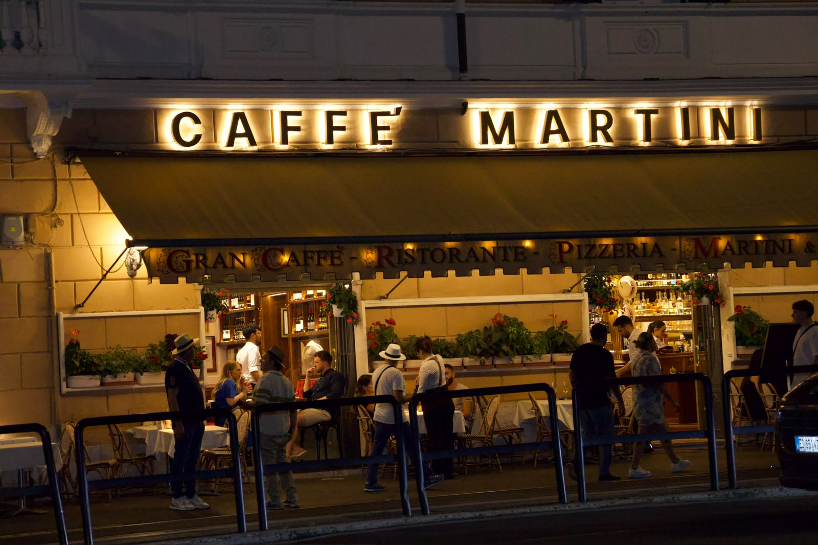 Caffè Martini storefront at night