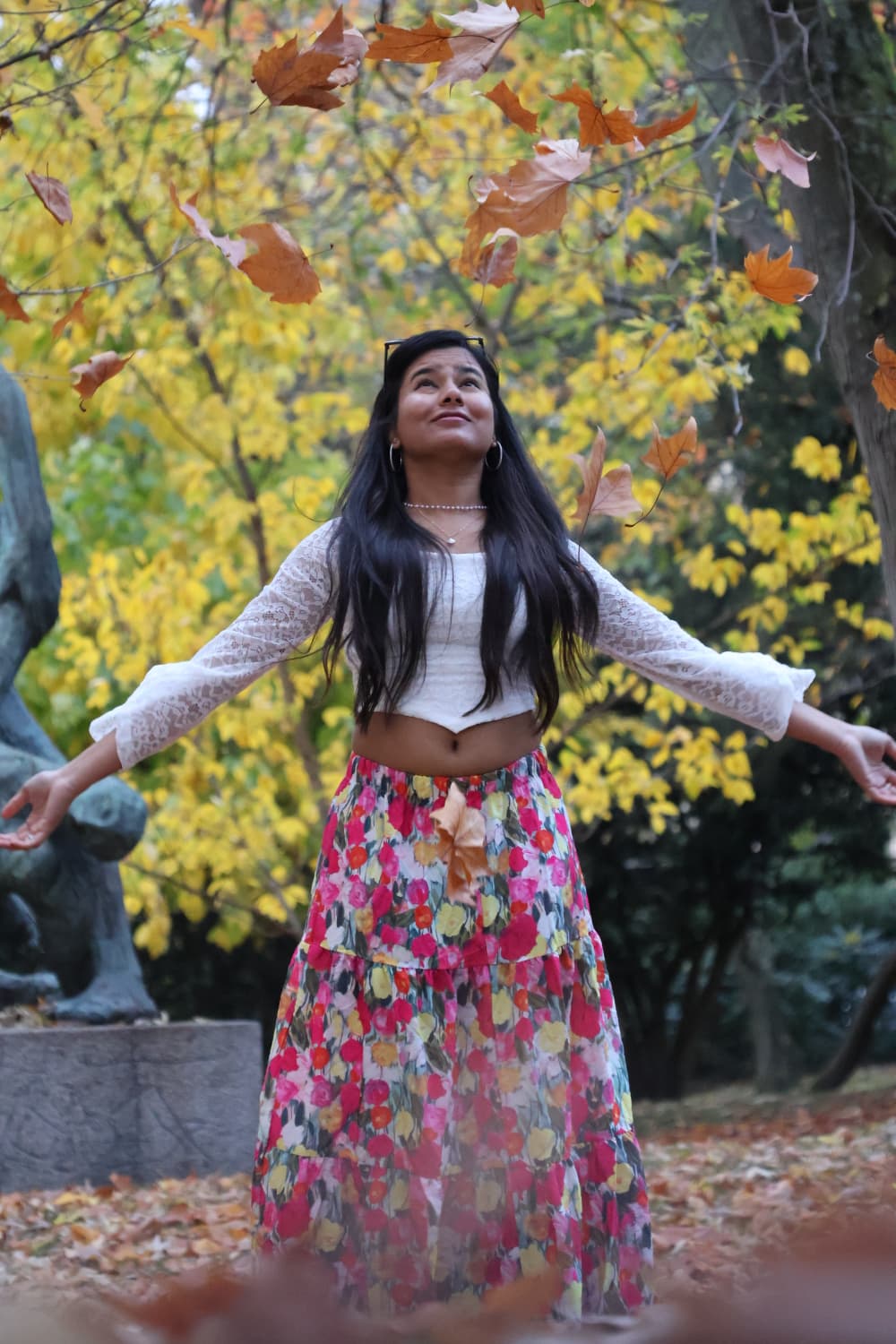 Autumn portrait, leaves falling in the park